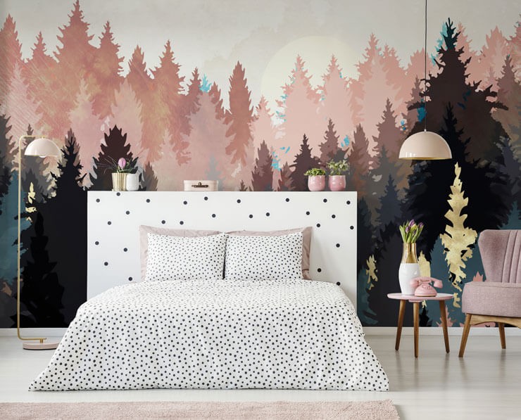 Pink and white bedroom with black and white polka dot bedsheets and a pink abstract tree wall mural with pink furniture