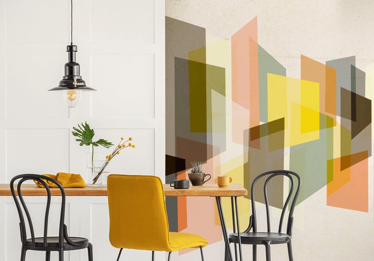retro abstract shapes wallpaper in dining area with yellow chair