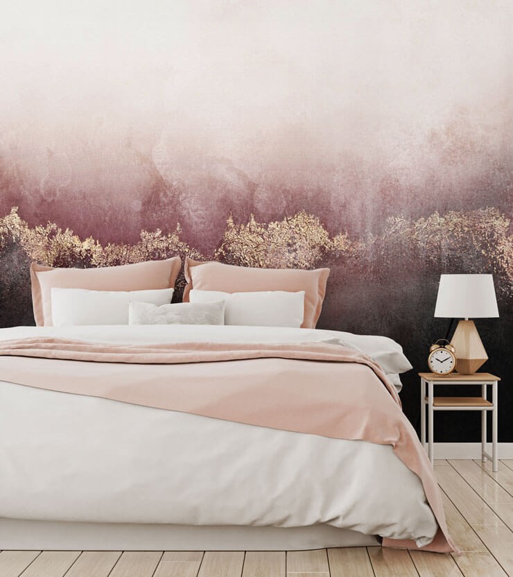 Bedroom with a ombre pink and black wallpaper in a bedroom with pink and white bedsheets