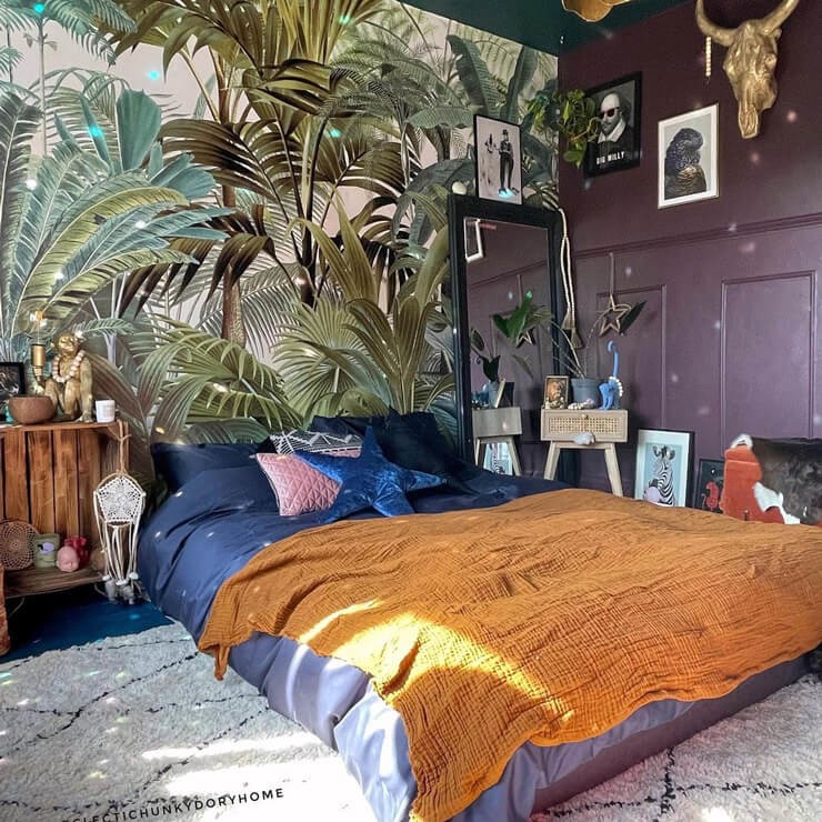 leafy green jungle wallpaper in maximalist bedroom