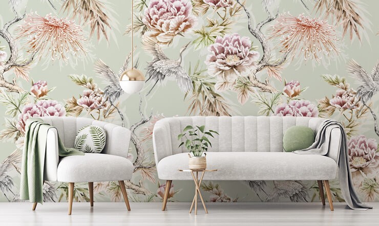 pastel green and pink crane wallpaper in grey and green lounge