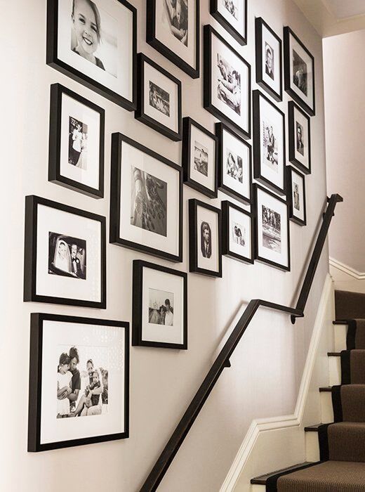 black and white pictures on a staircase