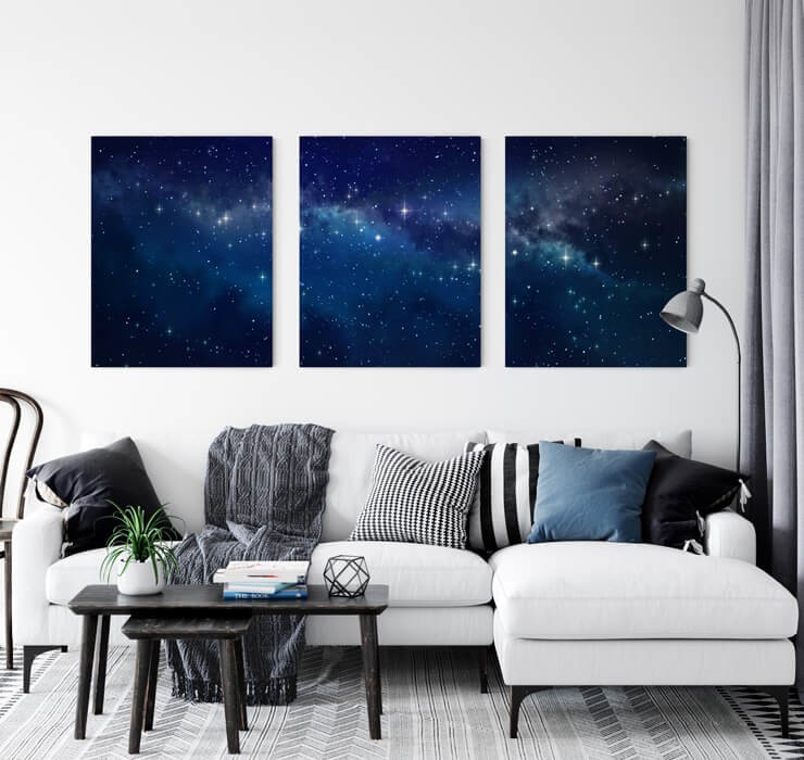 three star metal prints on wall in grey lounge