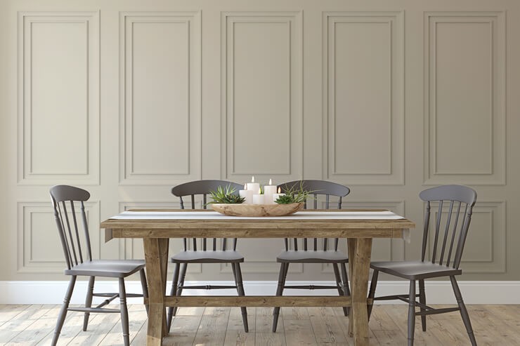 beige toned faux panel wallpaper with grey dining set