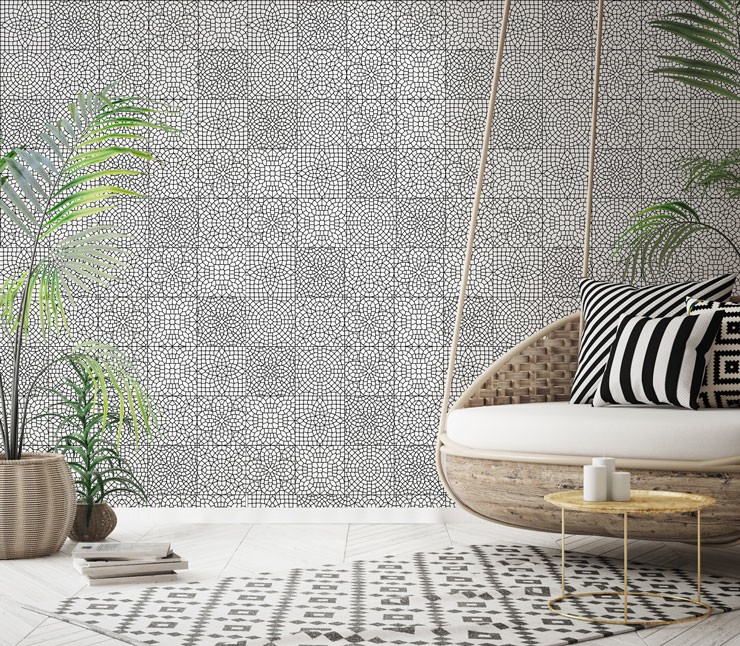 black and white patterned moroccan tile wallpaper in trendy boho lounge