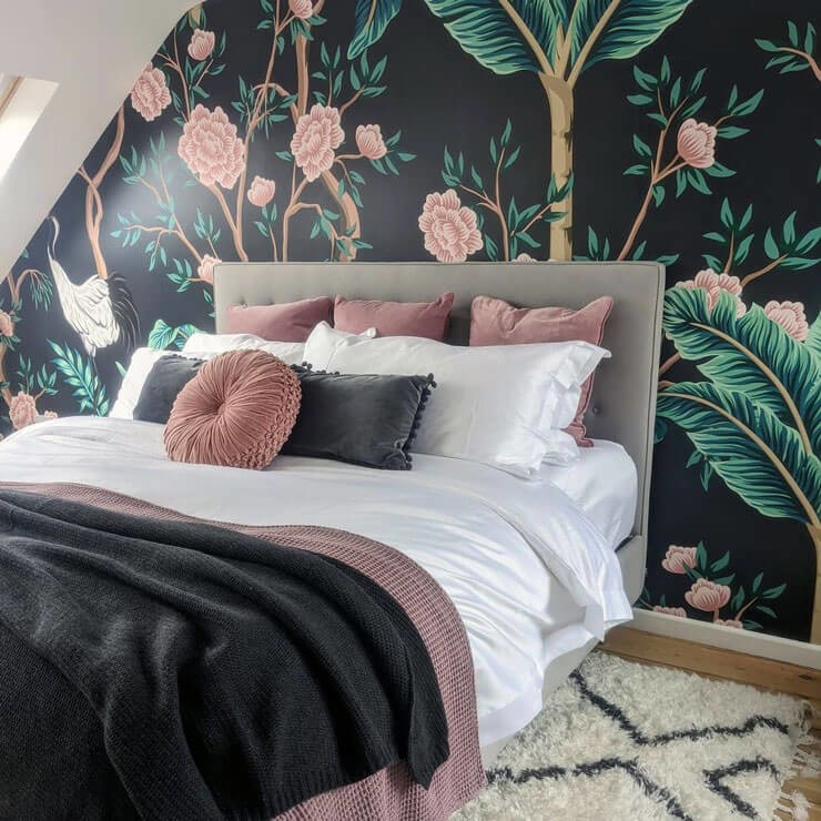 black and pink bird and flower wallpaper in pink and grey bedroom