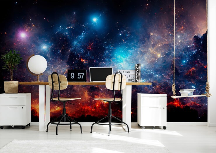 Blue and red nebular space wallpaper in a home office with white furniture and black accessories